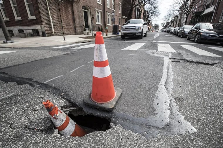 Awareness cones are no match for Philly's potholes. Could Domino's be the answer to our pothole repair prayers?