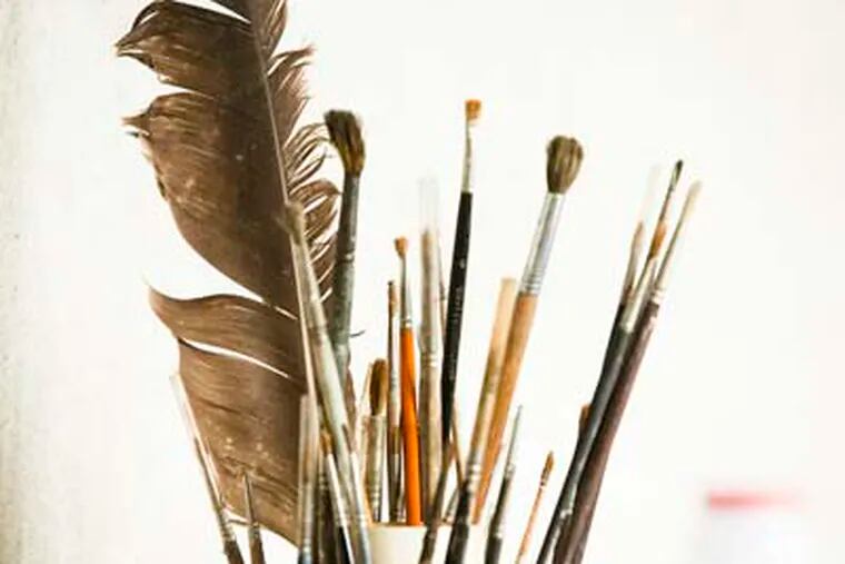 Ed Sozanski writes about Andrew Wyeth's Chadds Ford studio, which will be open to the public beginning July 3, 2012.  Here, some of Wyeth's brushes and a feather.( ED HILLE / Staff Photographer )
