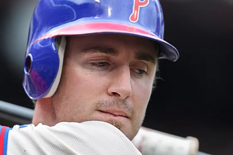 Chase Utley maintains his focus as he gets ready to hit for the Phillies. "He's an intense guy," teammate Jason Werth says.  (David M Warren / Staff Photographer)