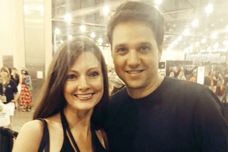 Daily News reporter Jenny DeHuff cozies up to Ralph Macchio (the real one) yesterday at the Pennsylvania Convention Center.