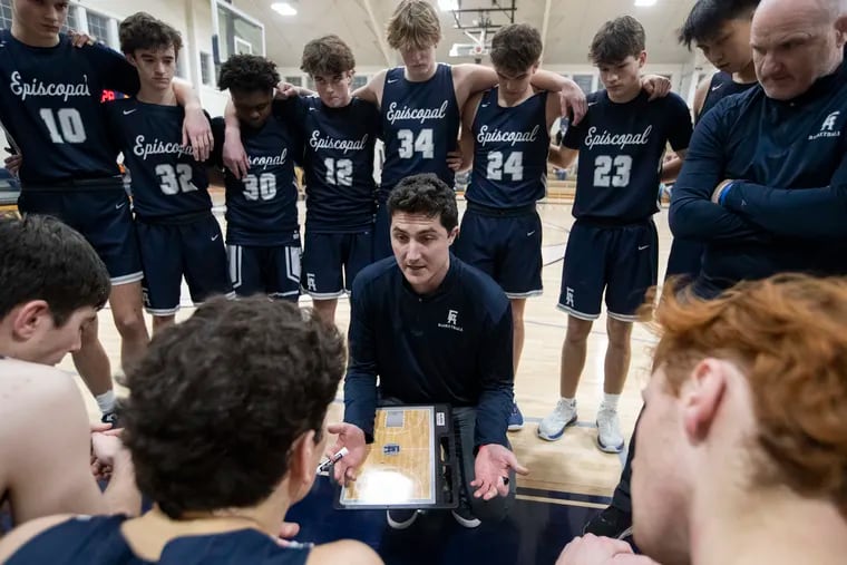 Taylor Wright, son of former Villanova coach Jay Wright, is the boys' varsity basketball coach at Episcopal Academy. He huddles the team during a game at Malvern Prep on Jan. 31.