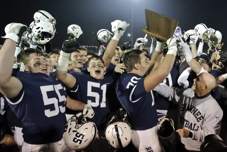 Shawnee football players celebrate after the Shawnee vs Hammonton HS South Jersey Group 4 championship football game at Rowan University in December.