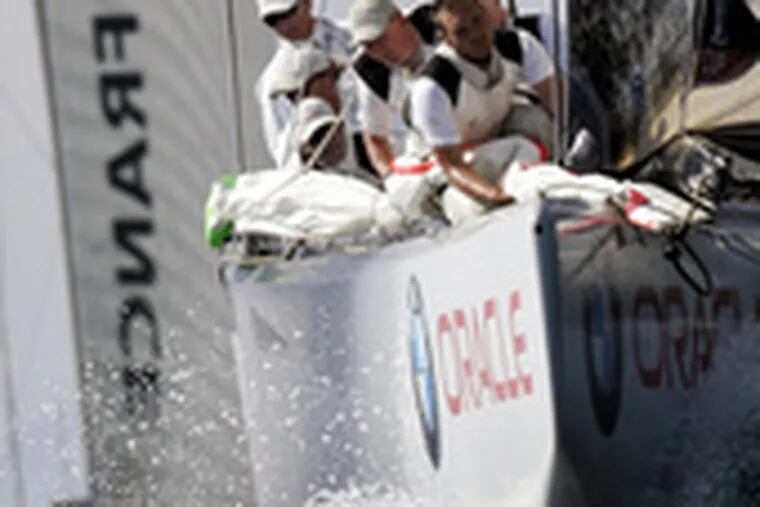 BMW Oracle Racing (front) tries to hold off French Areva Challenge during the Louis Vuitton Cup in Valencia, Spain.