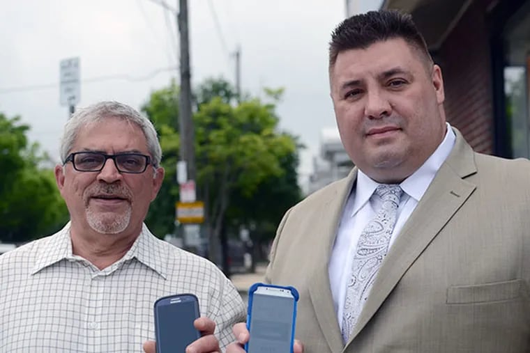Jerry Masciantonio, owner of The Cutting Point, left, and Michael D'Alfonso, President of Social Wifi on the corner of 17th and Oregon Avenue.  The Cutting Point provides free wifi through D'Alfonso's Social Wifi service.