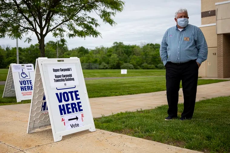 Eric Nelson, of Upper Gwynedd, Pa., stands outside to help voters to their correct polling stations at Pennbrook Middle School on Tuesday, June 2, 2020. Pennbrook Middle School has Upper Gwynedd districts one, three, and seven for people to come and vote.