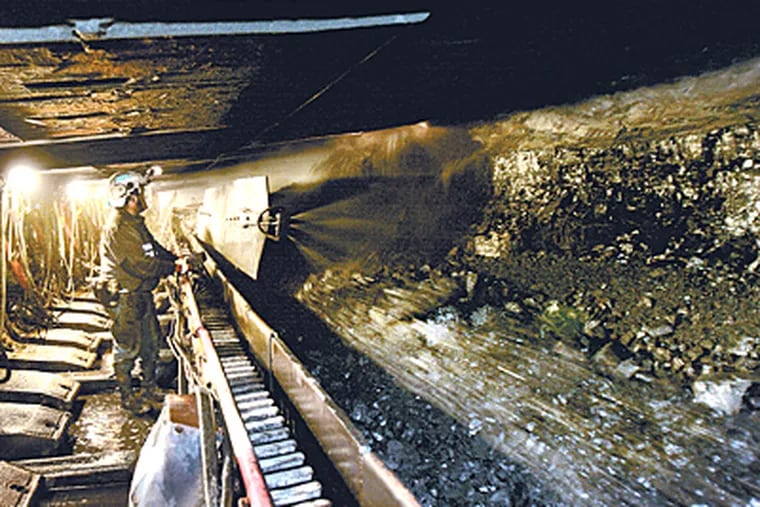 Shear operator Jay Gowdy during long wall mining at the Bailey Mine in Greene County, Pa. (Eric Mencher / Inquirer)