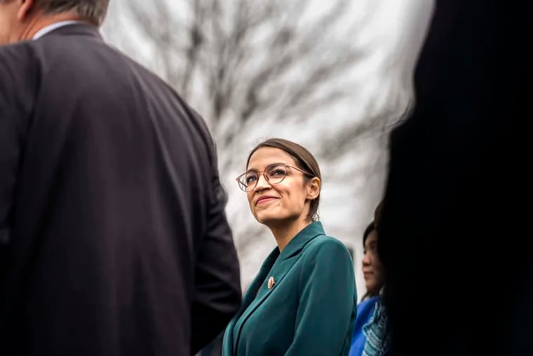 Rep. Alexandria Ocasio-Cortez (D-N.Y.) attends a news conference introducing a Green New Deal resolution last month.