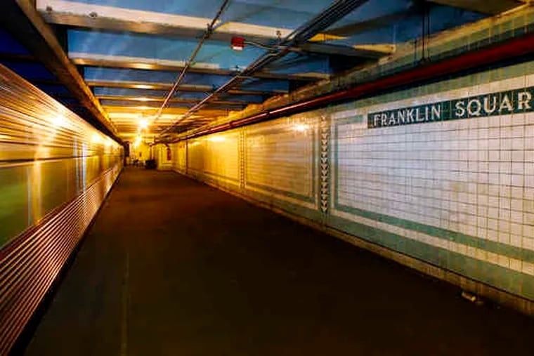 A PATCO High-Speed Line train bound for New Jersey passes the closed Franklin Square station at Seventh and Race Streets. The agency plans to refurbish the station and reopen it.