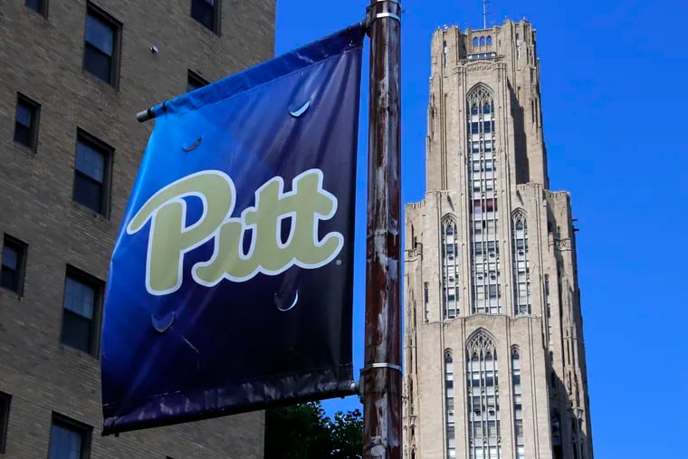 The Cathedral of Learning, right, towers over the University of Pittsburgh campus in the Oakland section of Pittsburgh Monday, July 8, 2019. Instead of a 19-story freshman dorm, students are staying in the Residence Inn Pittsburgh Oakland/University Place, a newly renovated three-star hotel with an indoor pool and stylish suites. (AP Photo/Gene J. Puskar)