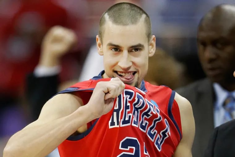 Mississippi guard Marshall Henderson (22) celebrates after a second-round game against Wisconsin in the NCAA college basketball tournament at the Sprint Center in Kansas City, Mo., Friday, March 22, 2013. Mississippi defeated Wisconsin 57-46. (Orlin Wagner/AP)