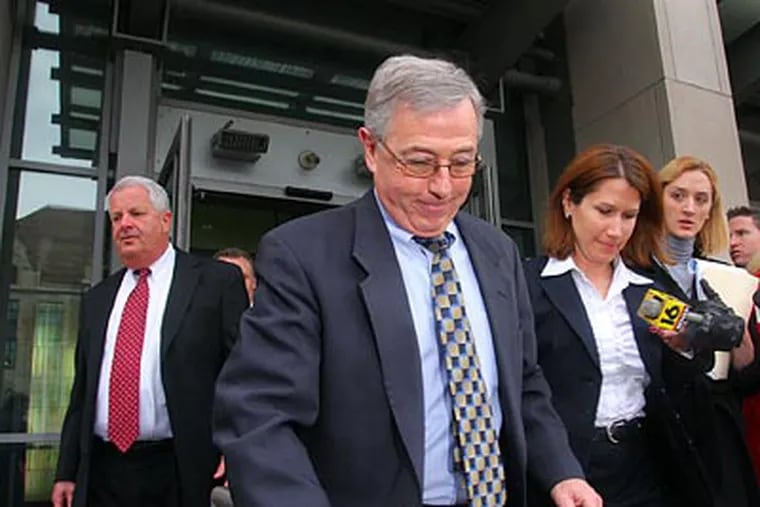 Mark A. Ciavarella (center) and Michael T. Conahan (far left) were charged with taking $2.6 million in payoffs to put juvenile offenders in private lockups. (Pamela Suchy/Times Tribune/AP file photo)