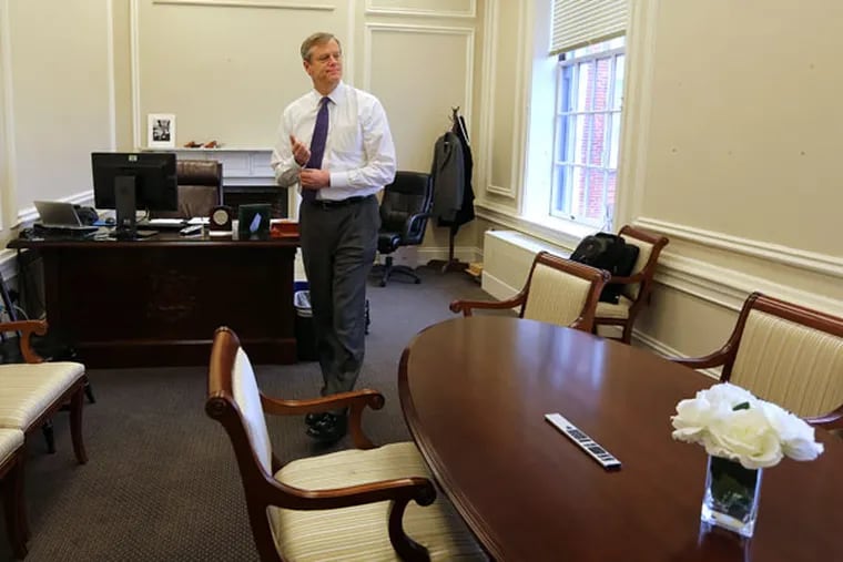 Massachusetts Gov. Charlie Baker settles in for his second day of work at the State House, on Monday, Jan. 12, 2015, in Boston. Baker, a Republican who was elected governor in November, made the donation in May 2011. (AP Photo/The Boston Globe, Pat Greenhouse)