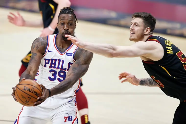 Sixers center  Dwight Howard grabs a rebound against the Cavaliers' Isaiah Hartenstein  in the first half.