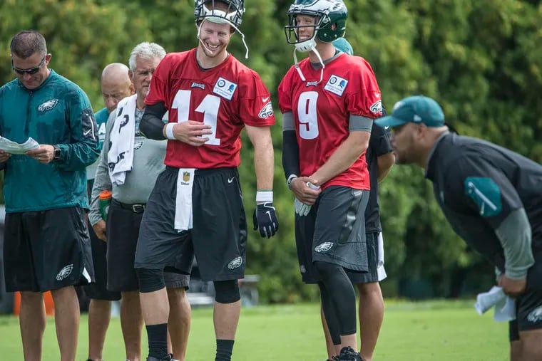 When training camp commences this time, Eagles quarterback Carson Wentz, on left, will be missing his friend and stand-in, Nick Foles, who is now the starter in Jacksonville.