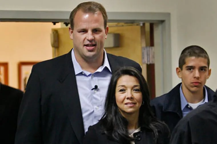 <b>Images of Election Day:</b> Philadelphia Eagles Jon Runyan casts his vote at Mount Laurel Fire Headquarters. With him are his wife Loretta and son Jon Jr.. (Alejandro A. Alvarez / Staff Photographer) <a href="http://www.philly.com/philly/news/politics/Scenes_from_the_campaign_trail.html?cmpid=100978044"> <b>SEE MORE ELECTION PHOTOS HERE</b></a>