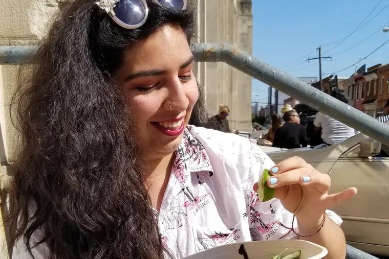 Alicia Frausto, organizer of the Philly chapter of Veggie Mijas, enjoys a Sweet Green vegan salad in South Philly.
