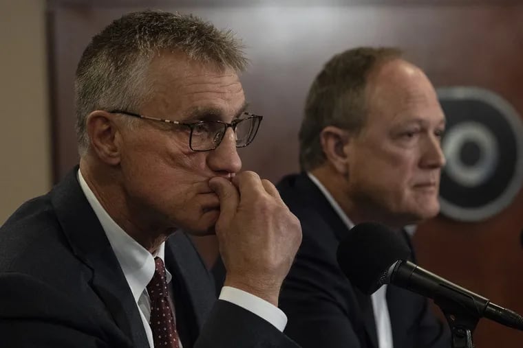 Comcast Spectacor CEO Dave Scott (right) and Flyers president Paul Holmgren discussed the firing of general manager Ron Hextall on Tuesday.
