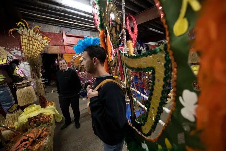 Mummers Golden Sunrise Captain, Mike Rubillo, right, and Jack Cohen, left, discuss the arrangements on wearing their heavy harnesses and back-pieces at their headquarters in South Philadelphia.Tuesday, December 11, 2018. JOSE F. MORENO / Staff Photographer