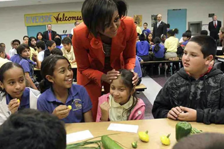 Michelle Obama with Miami pupils in November. The White House strategy builds on her health campaign and other initiatives. (Lynne Sladky / Associated Press)