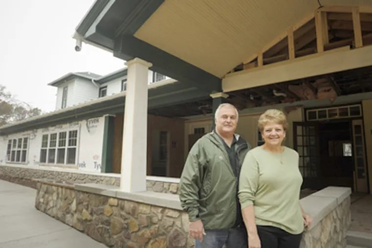 Rick and Gayle Buckman outside their inn, which will reopen in January as the Woodside Lodge at Spring Mountain. (Ron Tarver / Staff Photographer)