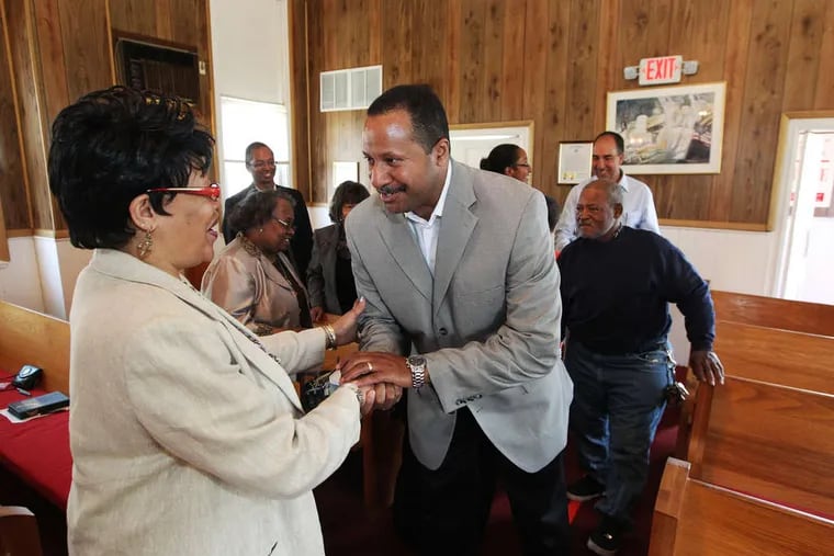 During Sunday service at Mount Zion A.M.E. Church in Woolwich, N.J., member Diana Pate welcomes visitor Terrence Jones, who had come to support the church, defaced last week by a misspelled racist epithet.