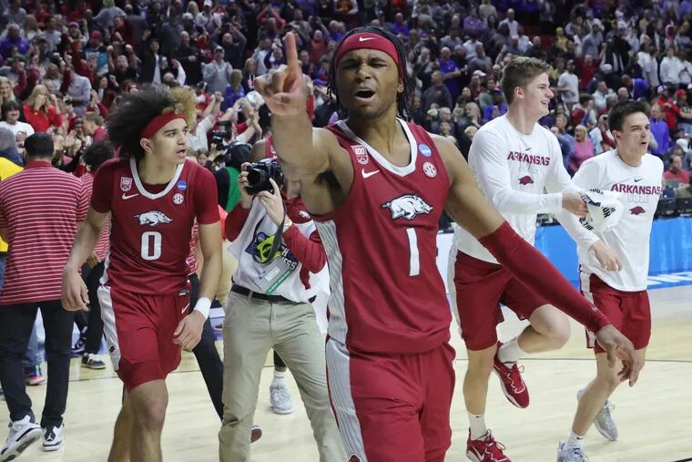 Arkansas’ Ricky Council IV celebrates with teammates after Saturday’s upset of defending national champion Kansas in the second round of the NCAA Tournament. The No. 8 seed Razorbacks face No. 4 UConn on Thursday in a Sweet 16 West Region matchup in Las Vegas. (Photo by Stacy Revere/Getty Images)