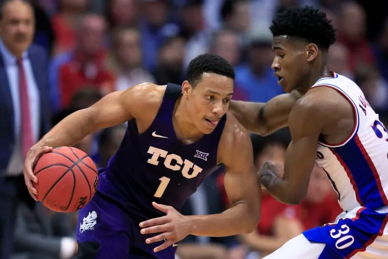 TCU guard Desmond Bane (left) drives on Kansas guard Ochai Agbaji in March. He could go 21st to the Sixers.
