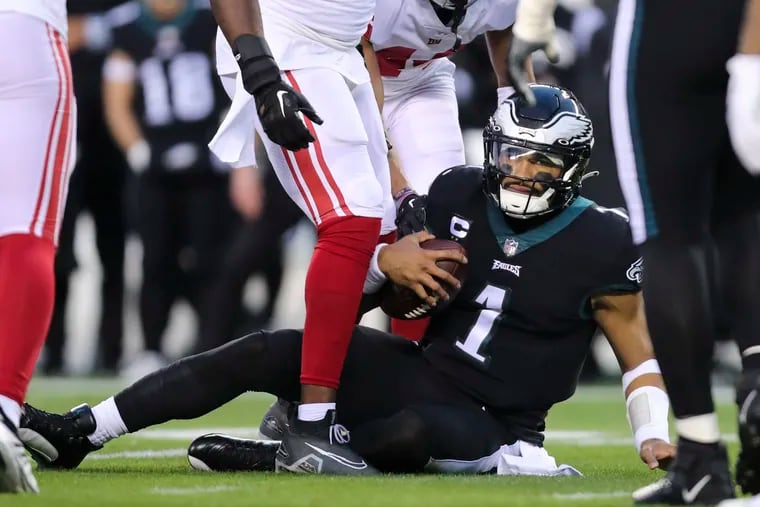Eagles quarterback Jalen Hurts safely slides on a run during the first half against the New York Giants.