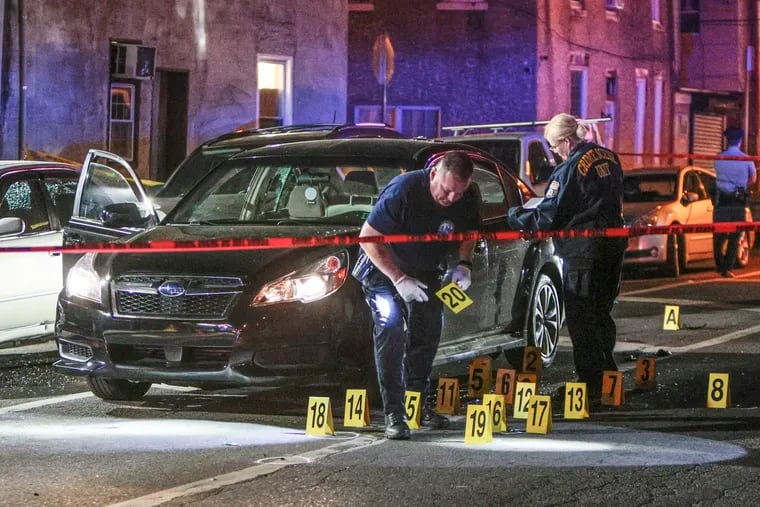 Philadelphia police on the scene last month of a double shooting that left one man dead and the other in critical condition.