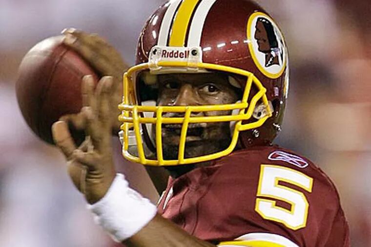 When Donovan McNabb returns Sunday, he will be running Mike Shanahan's style of offense, not Andy Reid's. (AP Photo / Evan Vucci)