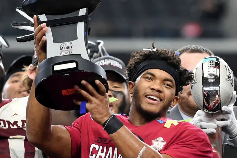 Oklahoma quarterback Kyler Murray hoists the Most Outstanding Player trophy after beating Texas 39-27 in the Big 12 Conference championship NCAA college football game on Saturday, Dec. 1, 2018, in Arlington, Texas. (AP Photo/Jeffrey McWhorter)