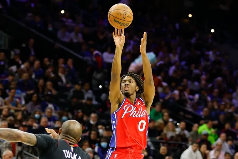 Sixers guard Tyrese Maxey shoots the basketball past Miami Heat forward P.J. Tucker on Monday, March 21, 2022 in Philadelphia.