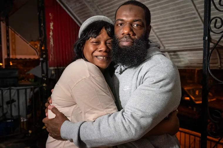 Rasheda Goodwin embraces her son Christopher Goodwin, right, after his conviction was overturned and he was released. "I never thought this day would come," he said, "but I stayed fighting."