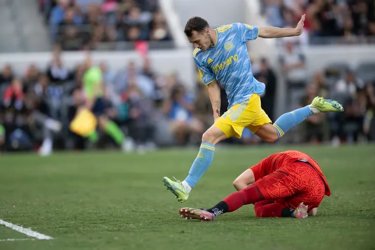 The Union's Dániel Gazdag leaps over Los Angeles FC goalkeeper Maxime Crépeau on Nov. 5.