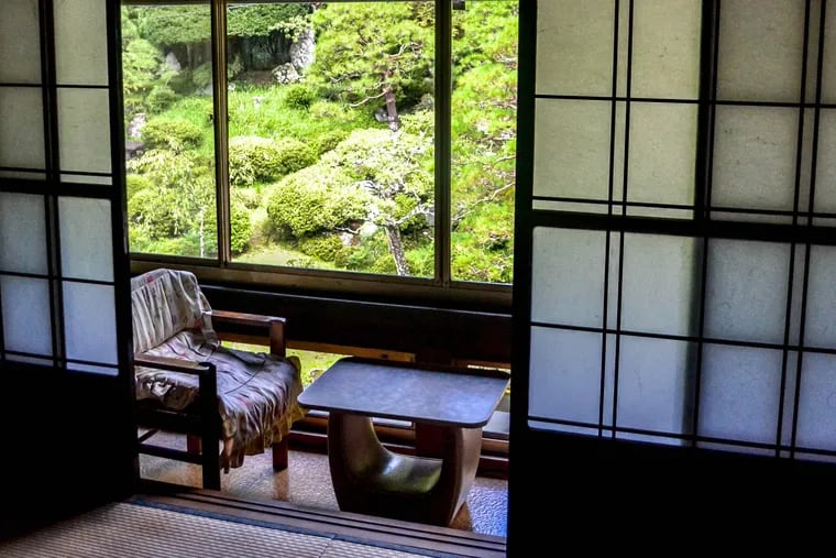 Typical wood sliding doors seen in room with a garden view at Kakurinbo, a Buddhist temple in Japan's Yamagata Prefecture.