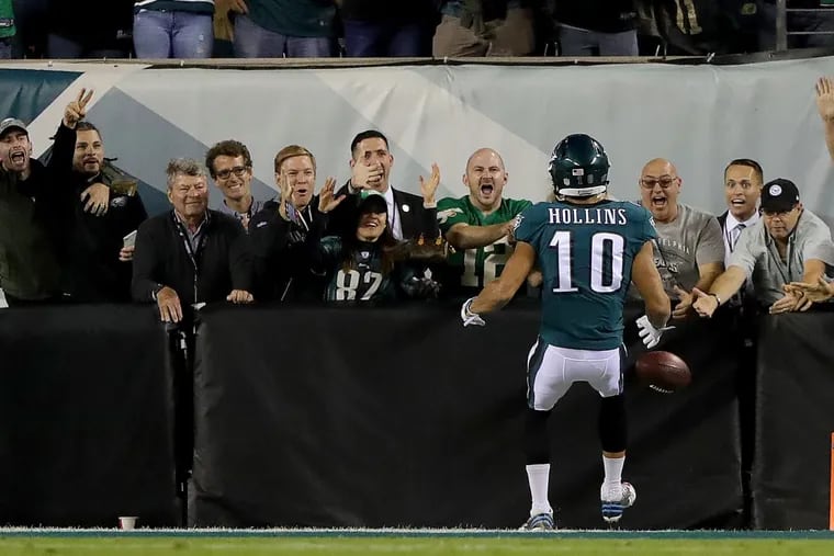 Eagles’ fans celebrate after Mack Hollins scores against the Redskins last Monday.