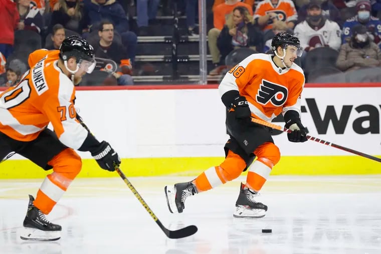 Flyers forward Morgan Frost (right) was one of 17 NHL players put in the NHL's COVID-19 protocol on Tuesday.