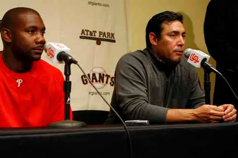 First baseman Ryan Howard and Phillies general manager Ruben Amaro Jr. (right) speak with reporters about the slugger's contract extension during a news conference in San Francisco.