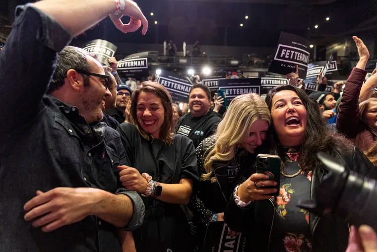 (From left to right) Close friends of the Fetterman’s, Patrick Jordan, Kristen Michaels, Leslie Wertheimer, and Lydia Morin, celebrate as John Fetterman is announced the winner  against Mehmet Oz for Pennsylvania State Senator at his Election Night Event at Stage AE in Pittsburgh, Pa., on Wednesday, Nov. 9, 2022.