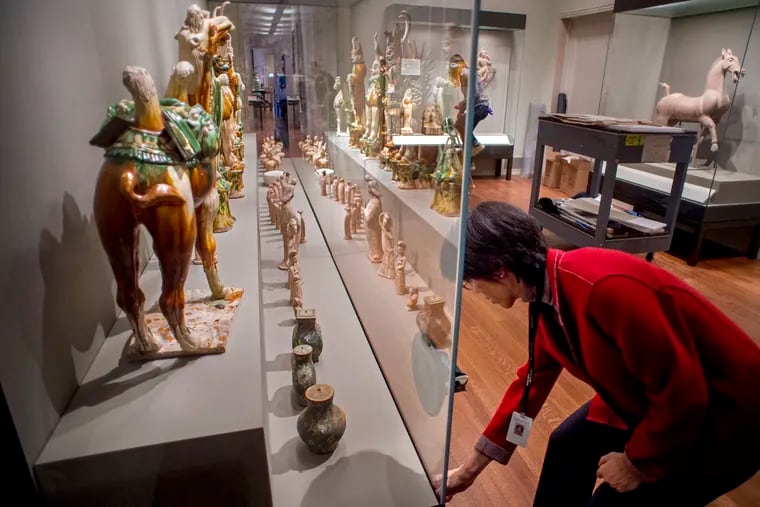 Curator Hiromi Kinoshita prepares for Sunday's grand reopening of the Philadelphia Museum of Art's Chinese galleries after a $2 million renovation.
