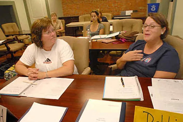 Susan Altringer of Voorhees (left) and Debbie Hackman of Marlton attended the program for aspiring teachers at Burlington County College last week.