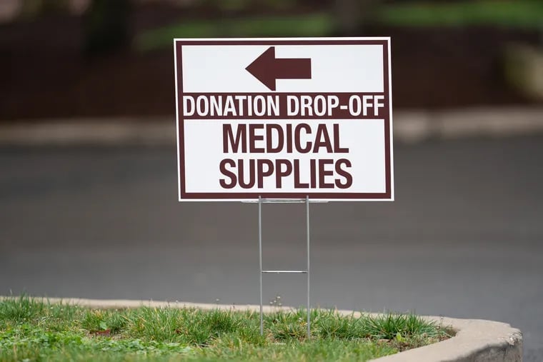 A sign directing people to the area where donated medical supplies are accepted at Doylestown hospital, in Doylestown, PA, March 30, 2020. Due to the spread of the coronavirus in the United States hospitals are in need of protective wear, and accepting donations.