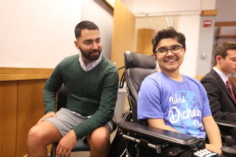Masterman School junior Yuva Gambhir, right, has Duchenne muscular dystrophy, which he studied in a lab at Penn last summer along with Ph. D. student Leon Morales.