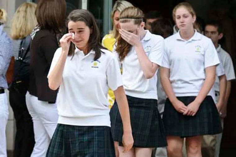 St. Monica Catholic school students cry as they leave the farewell mass at St. Monica Catholic church. The school closed in June. An expanded corporate tax credit that is part of Gov. Corbett's newly signed budget will benefit private schools. (RON TARVER / Staff Photographer )