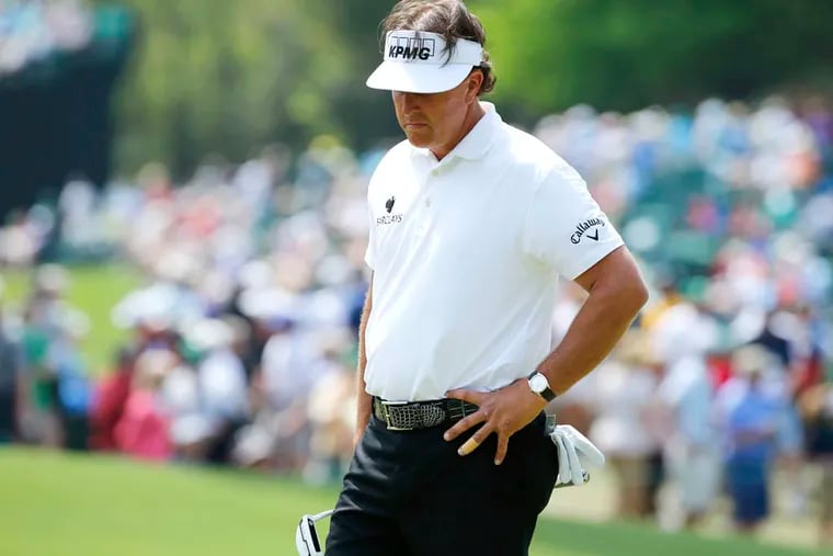 U.S. golfer Phil Mickelson reacts after a missed putt on the sixth hole during the second round, which would turn out to be his final one at this year's Masters.