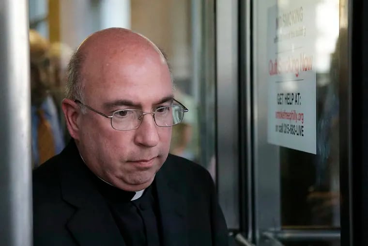 The Rev. Andrew McCormick exits the Criminal Justice Center after a hearing on Aug. 16, 2012, in Philadelphia. ( Matt Rourke / AP Photo )