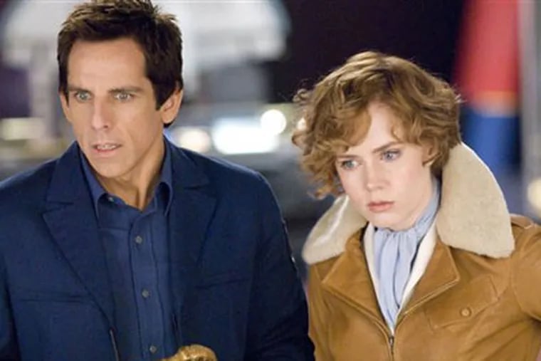 In this film publicity image released by 20th Century Fox, Ben Stiller and Amy Adams are shown in a scene from "Night at the Museum: Battle of the Smithsonian."