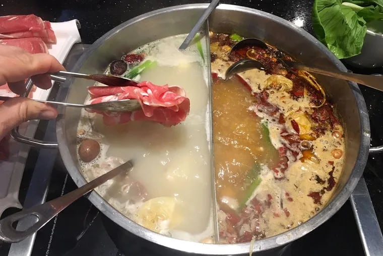 The “half and half” style hot pot at Little Sheep Mongolian Hot Pot, 1019 Arch St.