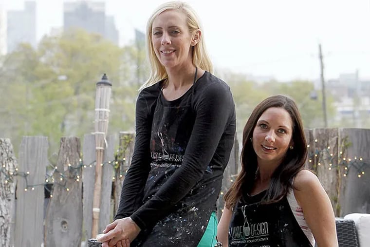 Business partners Emmy Preiss, left, and Harriet Mills launched a Wine and Design in 2010 and eventually gave into demand and started offering franchise opportunities. (Travis Long / Raleigh News & Observer / MCT)