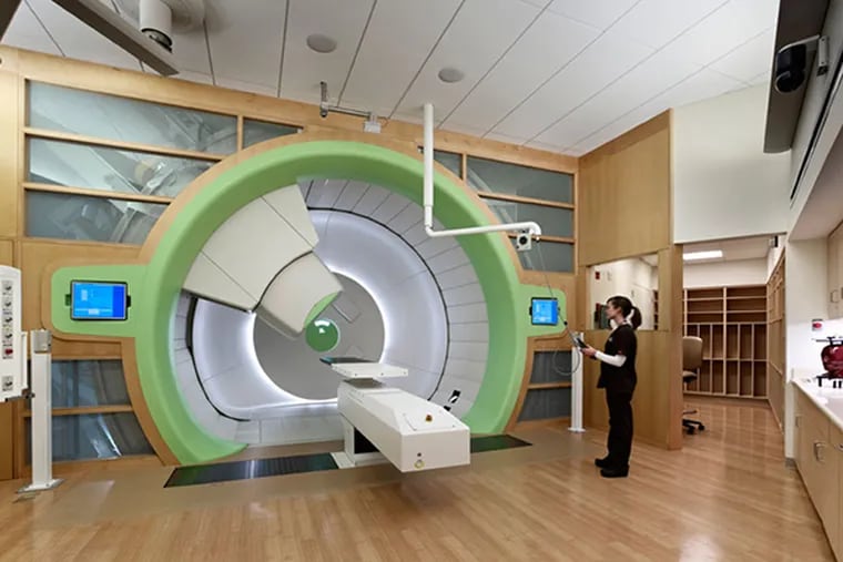 A Radiation Oncology tech in one of the four gantry rooms at the Roberts Proton Therapy Center. Approximately 75,000 square feet in size, the Center is located in a mostly underground building interconnected to the Perelman Center for Advanced Medicine. (Photo courtesy of Penn Medicine)